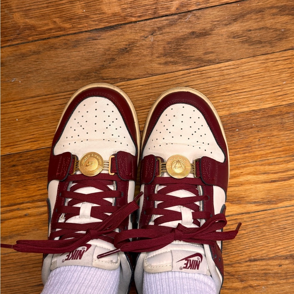 Nike Maroon and Beige Sneakers with Gold Accents